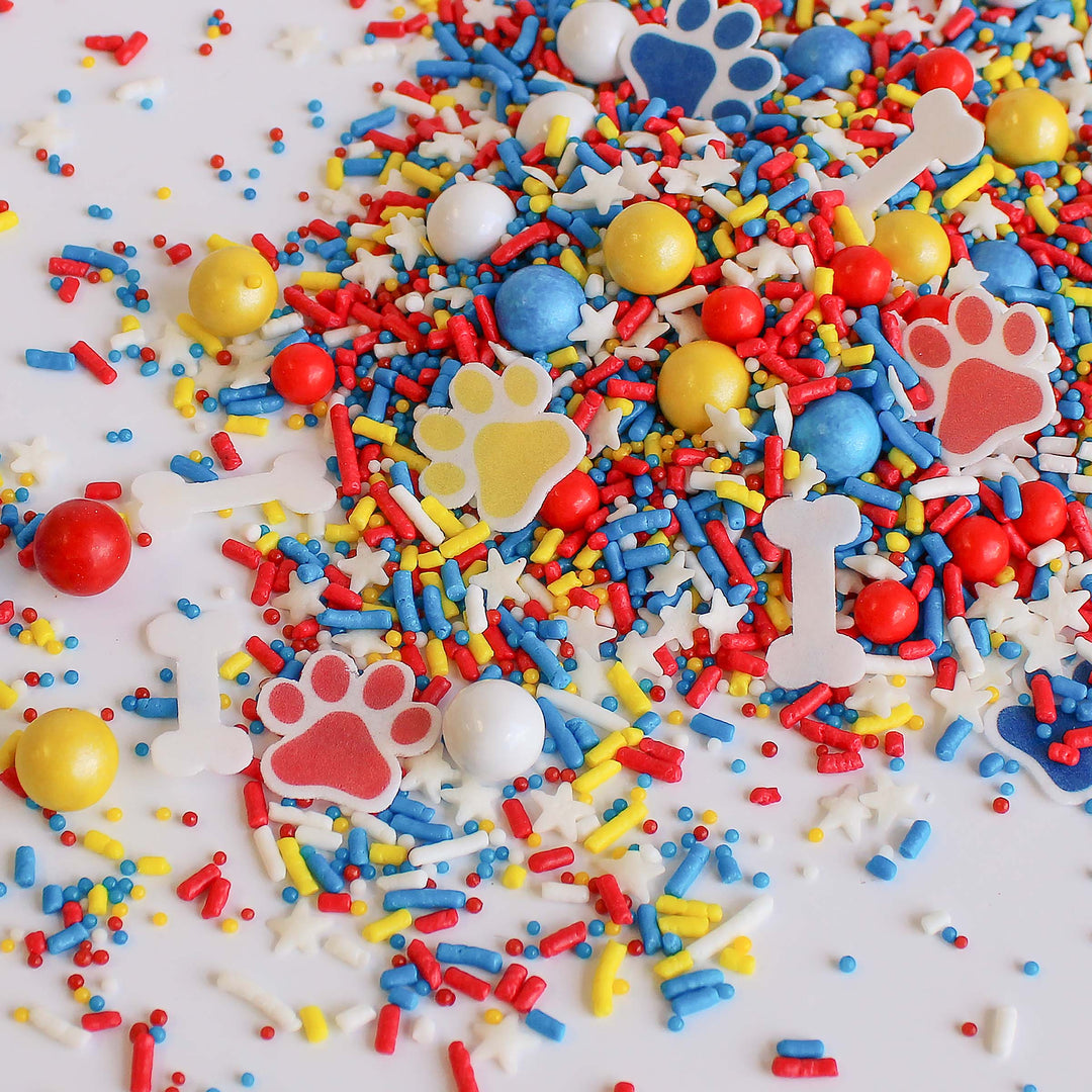 Close-up of Paw Patrol Sprinkle Mix with wafer paw prints and dog bones.