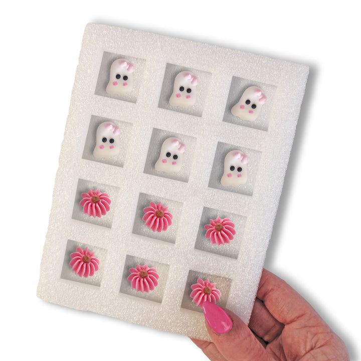 Boo-tifully Pink Royal Icing Decs featuring cute pink ghost designs for Halloween-themed desserts (12 count).