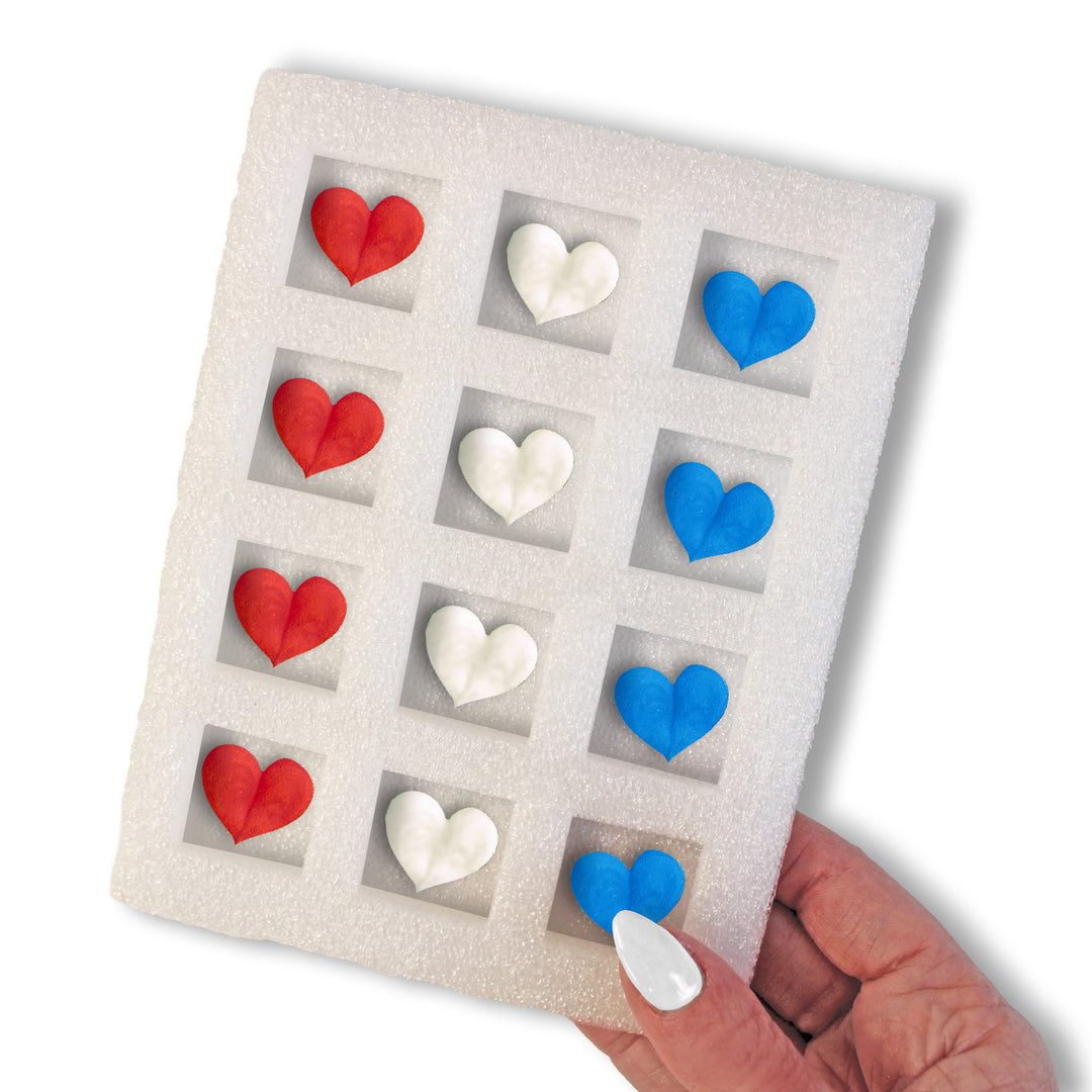 Set of 12 Red White Blue Hearts Royal Icing Decorations for cakes and cupcakes, perfect for 4th of July celebrations.