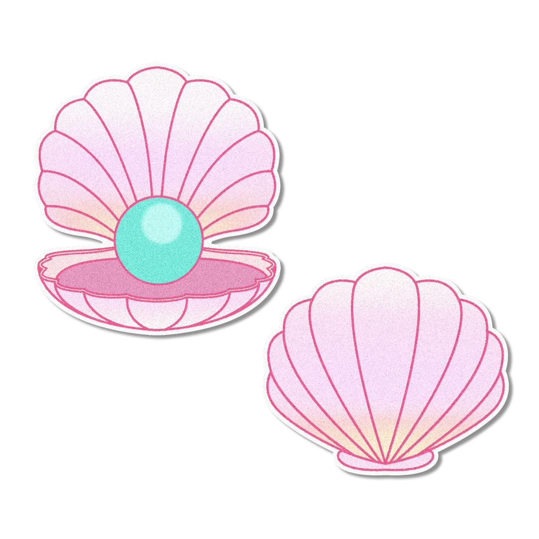 Pink seashell-shaped edible cupcake toppers, perfect for adding a whimsical summer and mermaid touch to cakes, cupcakes, and other desserts.