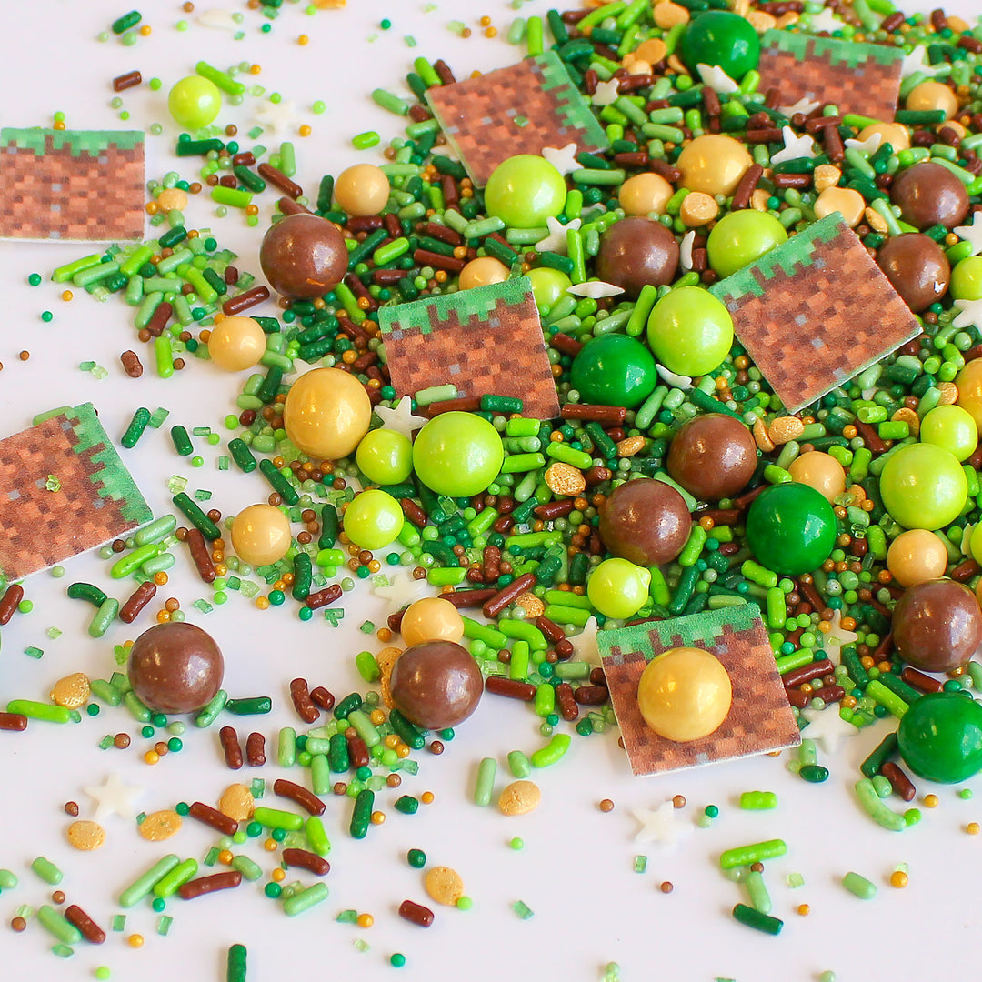 Close-up of Sprinkle Craft Sprinkle Mix with green and brown wafer sprinkle craft squares, ready to be used for decorating cakes, cookies, cupcakes and more.