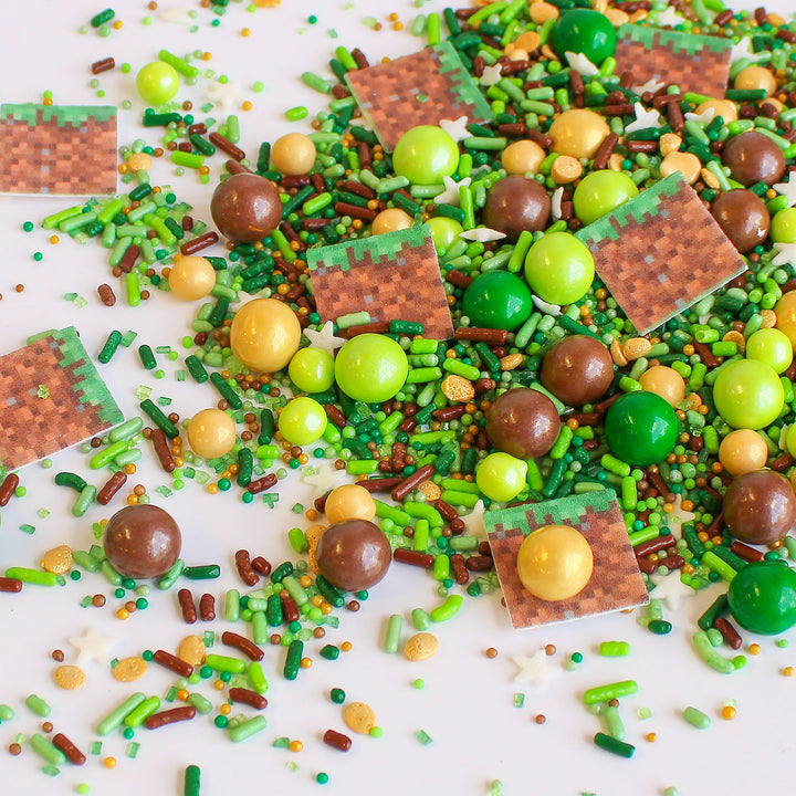 Close-up of Sprinkle Craft Sprinkle Mix with green and brown wafer sprinkle craft squares, ready to be used for decorating cakes, cookies, cupcakes and more.