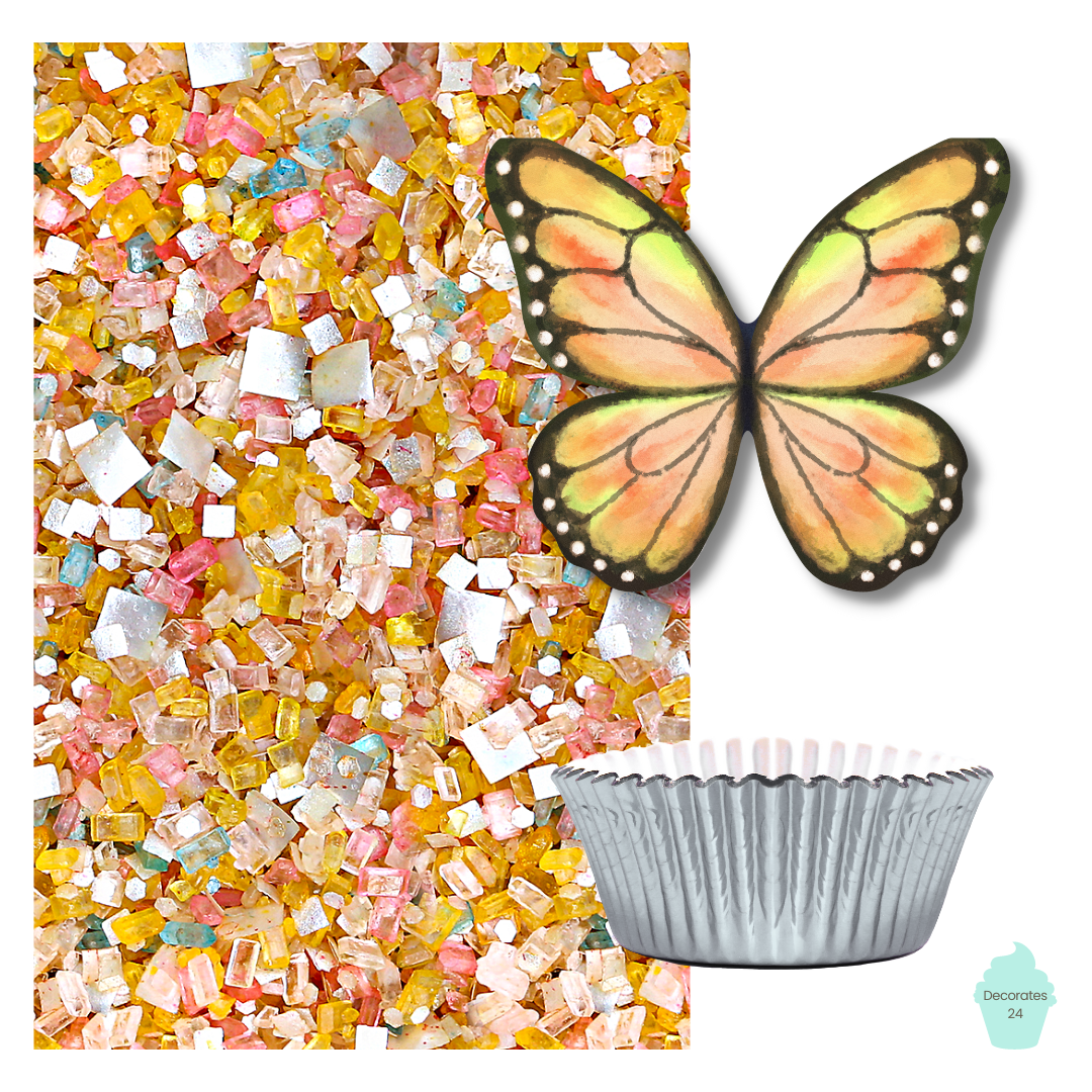 A photo of a yellow cupcake with a yellow butterfly edible wafer cupcake topper on top, surrounded by "It's A Party" glittery sugar and yellow cupcake liners