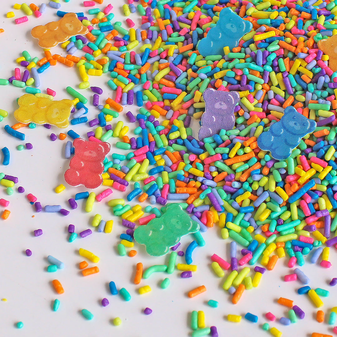 A close-up photo of Gummy Bear Sprinkle Mix with a variety of colorful sprinkles, including specialty wafer gummy bears.