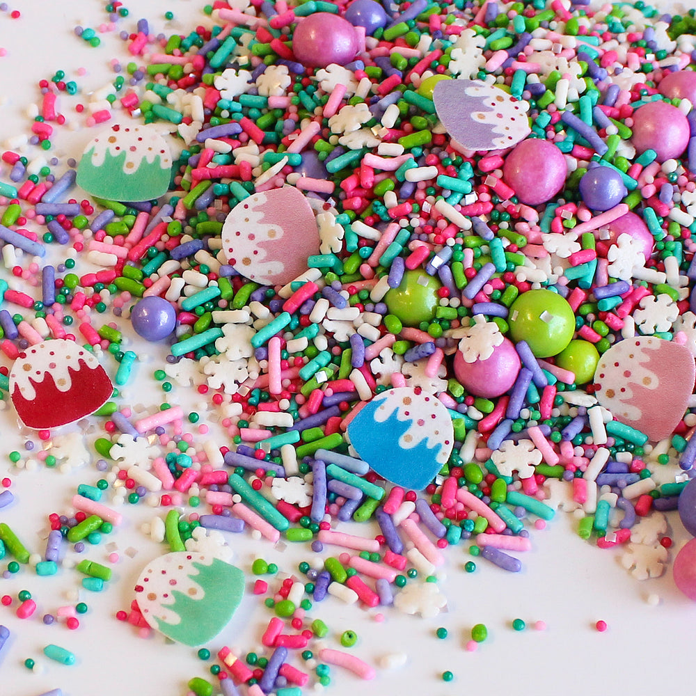 A close-up image of Gumdrop Sprinkle Mix, showcasing its vibrant pastel colors, confetti snowflakes, and cute wafer gumdrops. Perfect for Christmas and winter desserts.