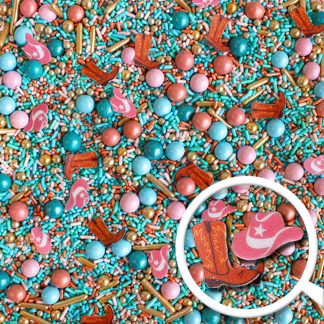 Close-up of Rodeo Queen Sprinkle Mix - vibrant mix of Teal, Rose Gold, Light Pink, Vintage Gold, and Dusty Blue colors with specialty pieces of wafer paper cowboy boots and pink cowgirl hats.