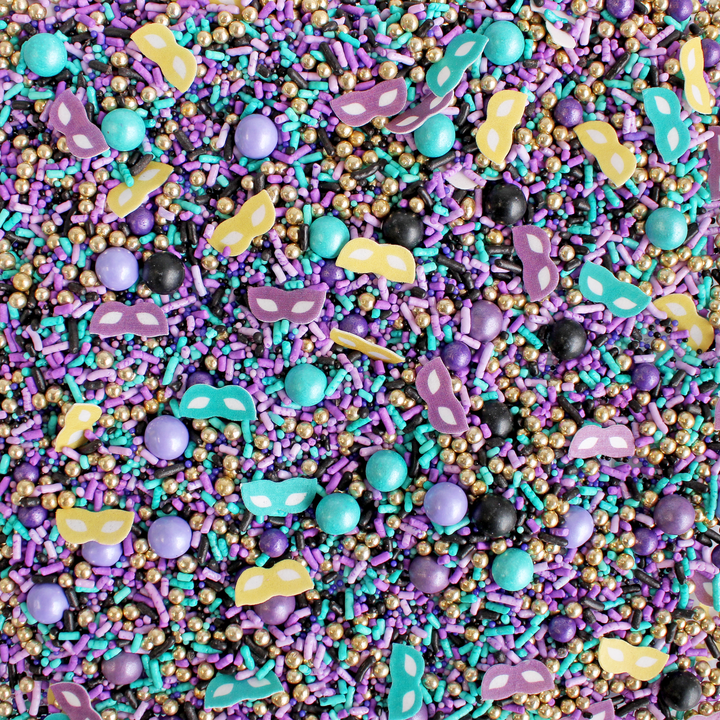 "Masquerade Sprinkle Mix in Mardi Gras colors of teal, black, gold, and purple for festive cake decoration"