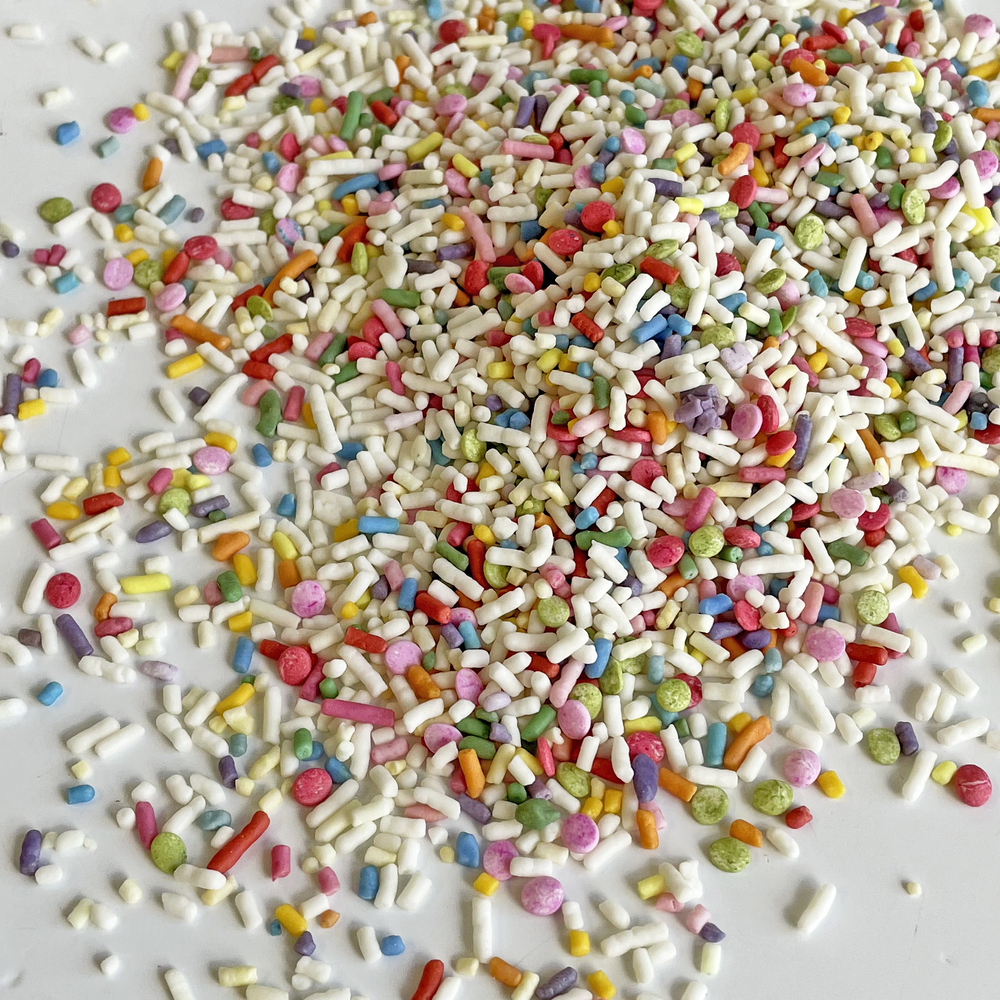 Vibrant natural color sprinkle mix for baking, no artificial dyes, perfect for birthday and rainbow-themed desserts.