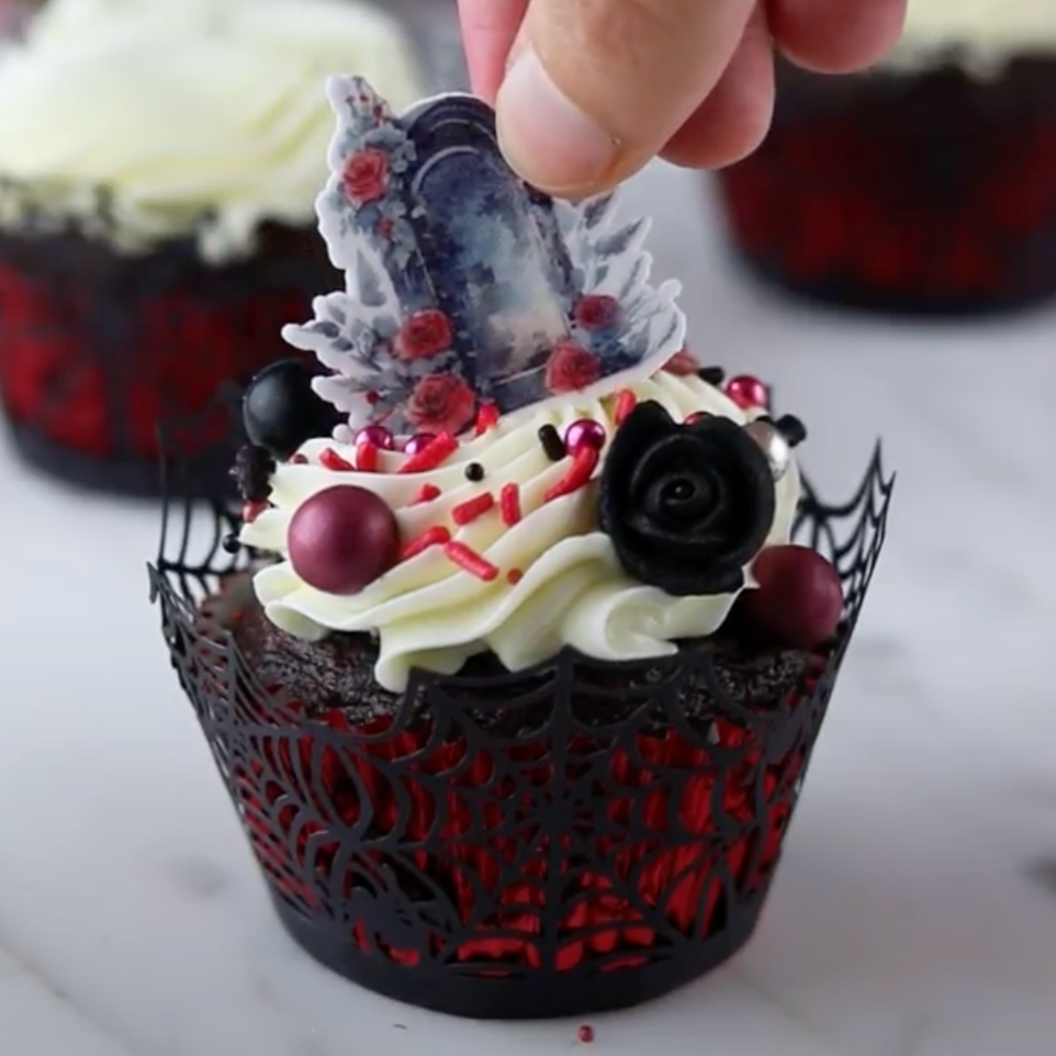 Gothic Graveyard Cupcake Kit - showcasing the contents of the kit, including sprinkle mix, toppers, and black spiderweb cupcake liners.