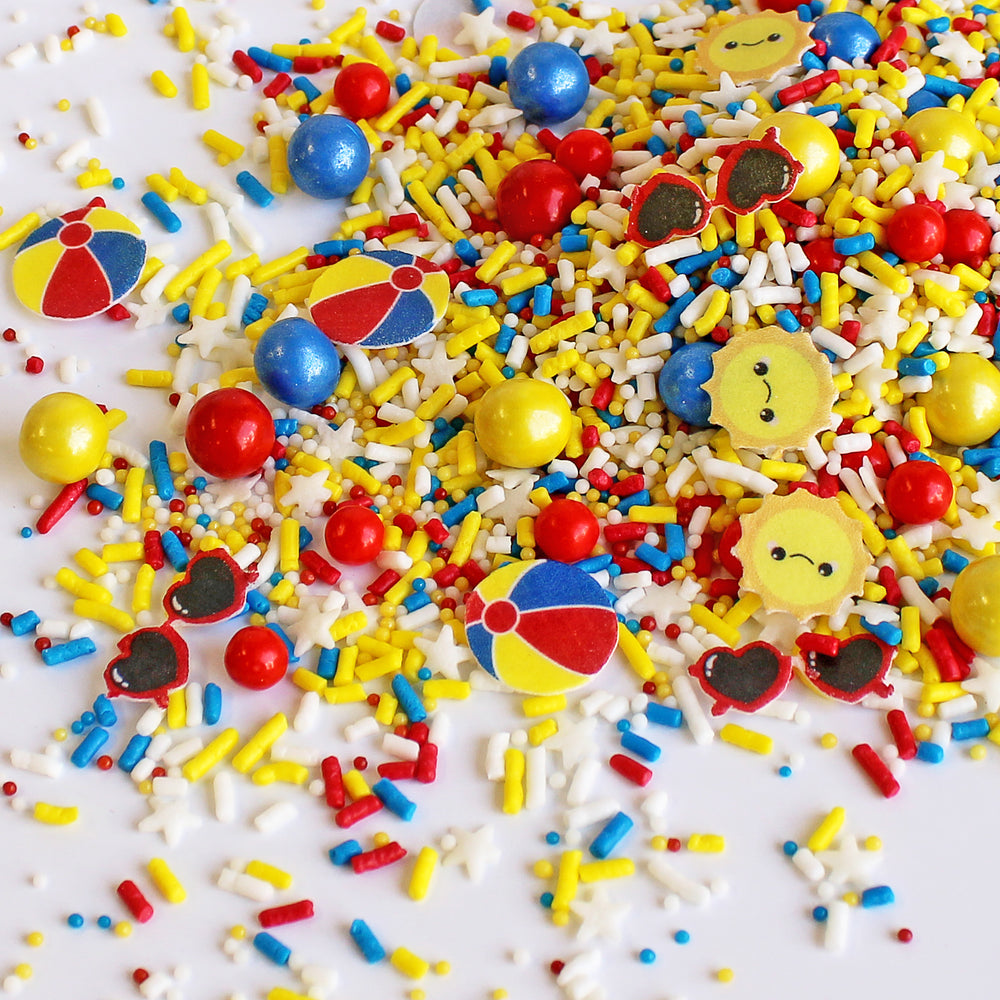 Summer Fun Sprinkle Mix - A vibrant mix of colorful and shaped sprinkles, including wafer beach balls, smiling suns, and sunglasses.