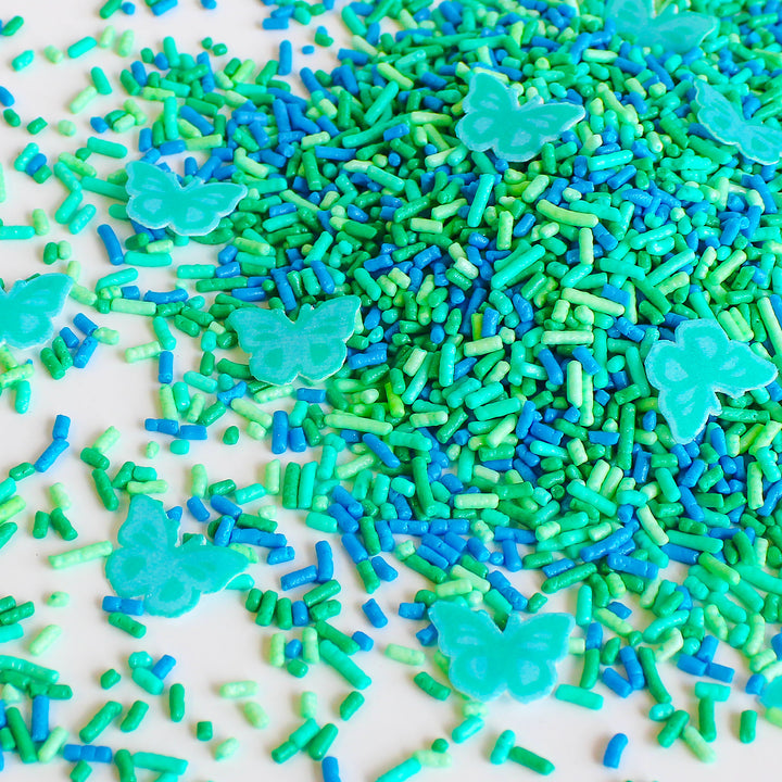 Taylor Swift Sprinkle Mix - Playful blend of teal, blue, and green sprinkles with wafer paper butterflies, perfect for adding a touch of musical magic to your edible creations.