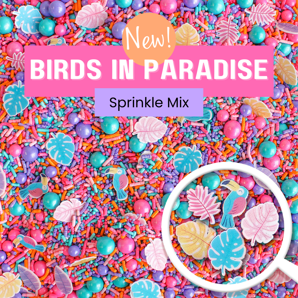 Birds In Paradise Sprinkle Mix - A vibrant blend of aqua, pink, purple, and orange sprinkle shapes with tropical birds and palm fronds.