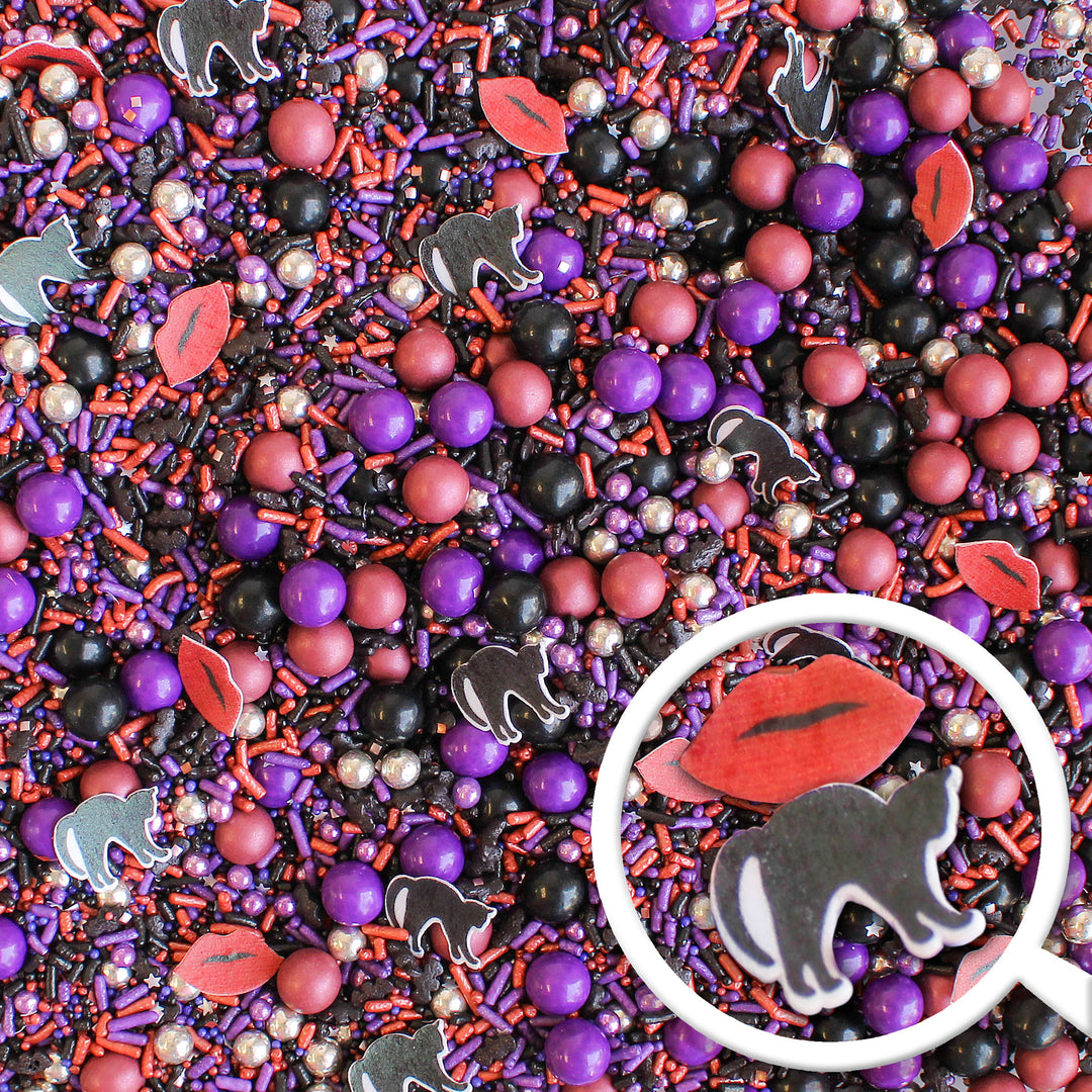 Chilling Sprinkle Mix - Halloween-themed sprinkle mix with purple, black, silver, and burgundy colors, black cat and lip shapes.