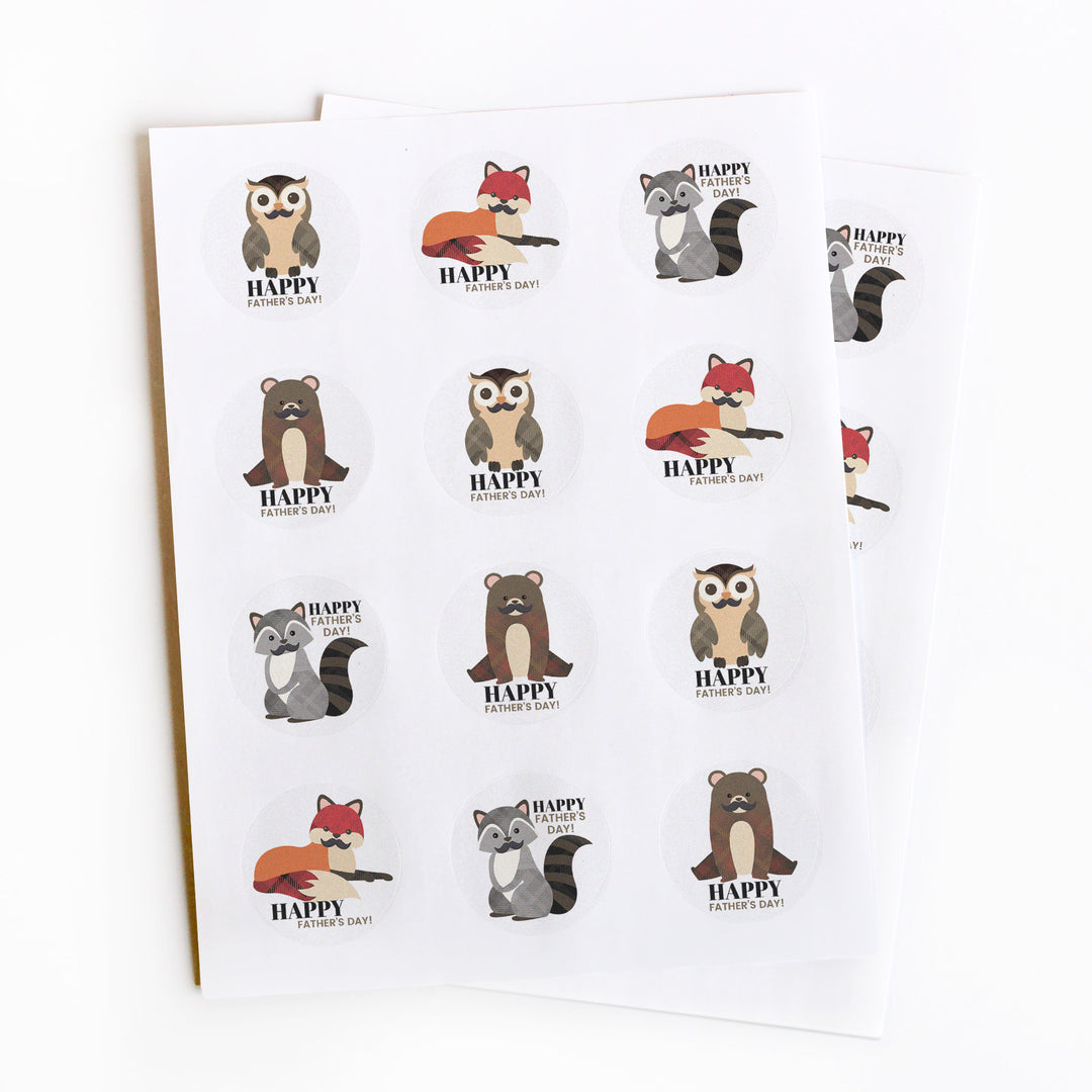 Image of animal with mustache stickers for Father's Day treats. Designs include a fox, bear, raccoon, and owl.
