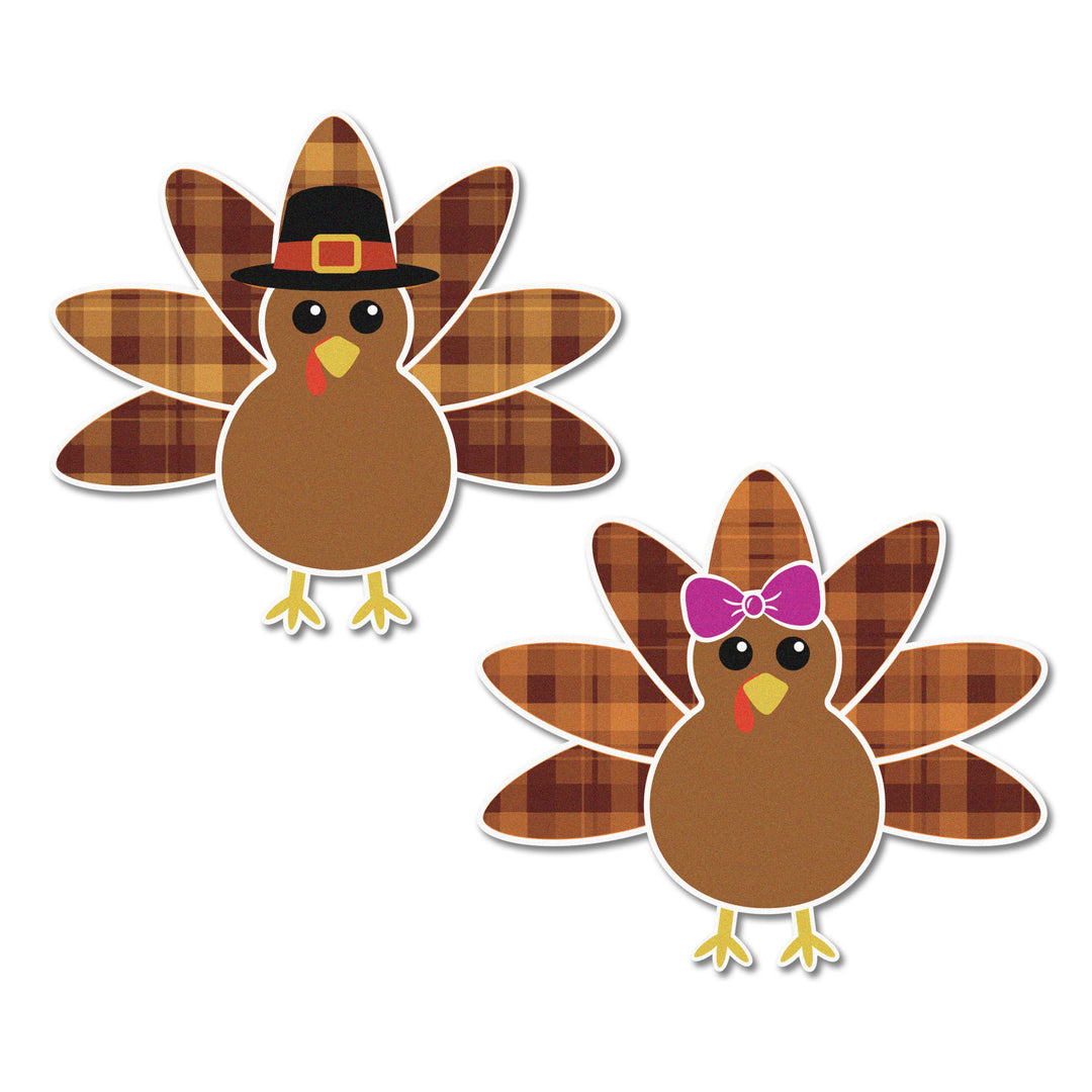 Close-up of Plaid Edible Cupcake Toppers - showcasing the charming details of turkeys with bows and pilgrim hats on a plaid background.