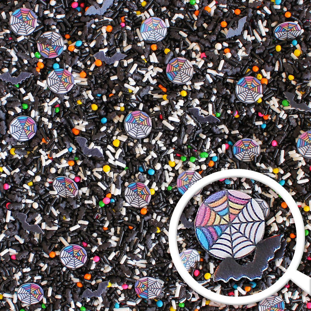 Woes Sprinkle Mix - Halloween-themed sprinkle mix with black and rainbow colors, spider webs, and bats.