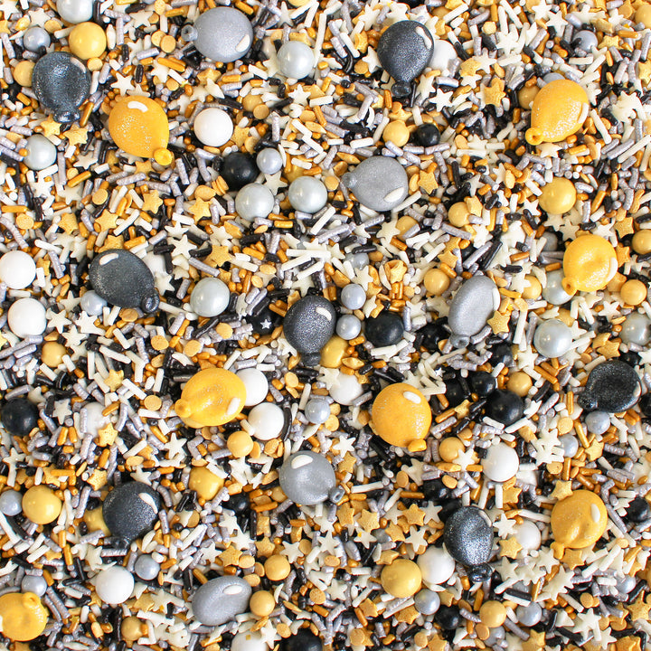 Image of Graduation Sprinkle Mix with black, gold, and silver sprinkles, and royal icing glittery balloons.
