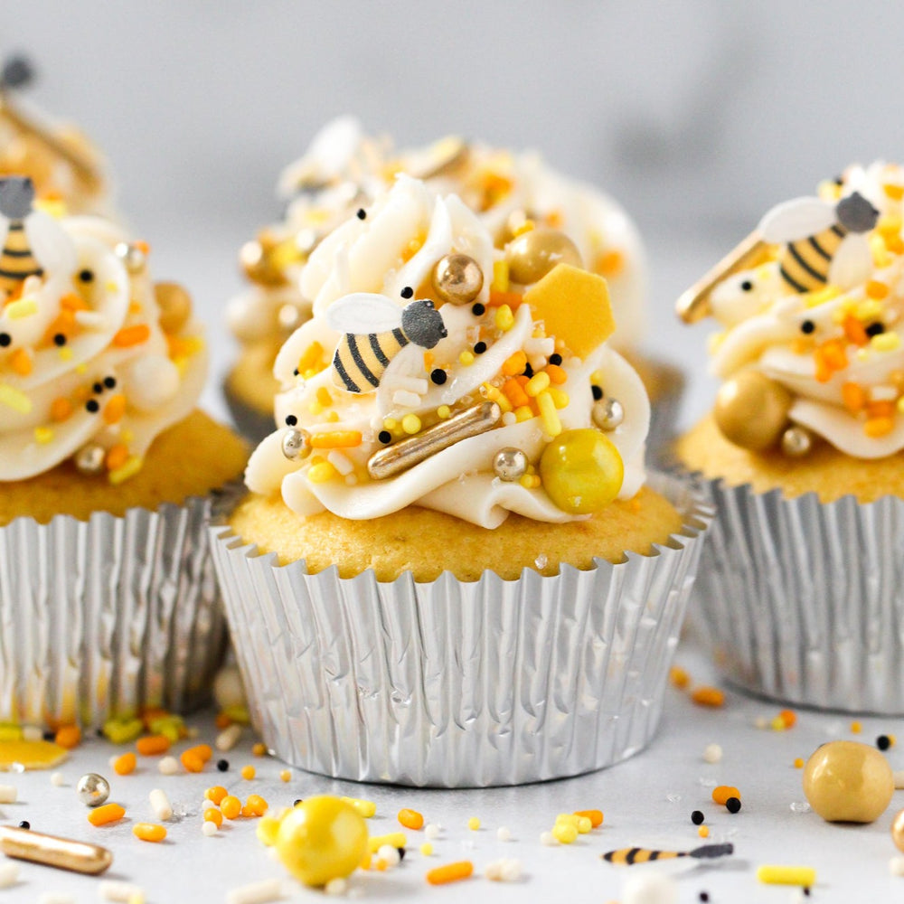 Vanilla cupcakes decorated with Honey Bee Sprinkle Mix