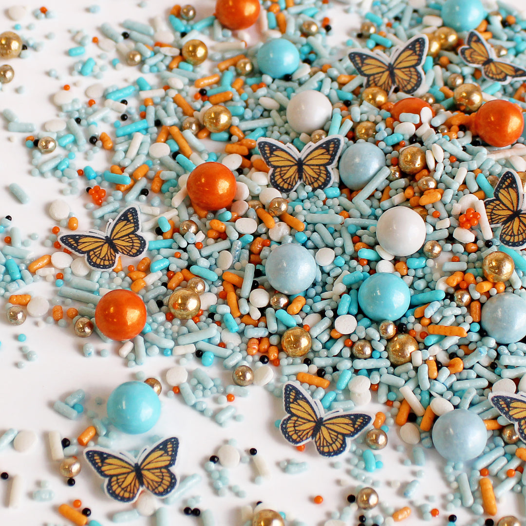 Monarch Butterfly Sprinkle Mix - Light blue sprinkles with vintage gold accents and black and orange wafer paper butterflies.