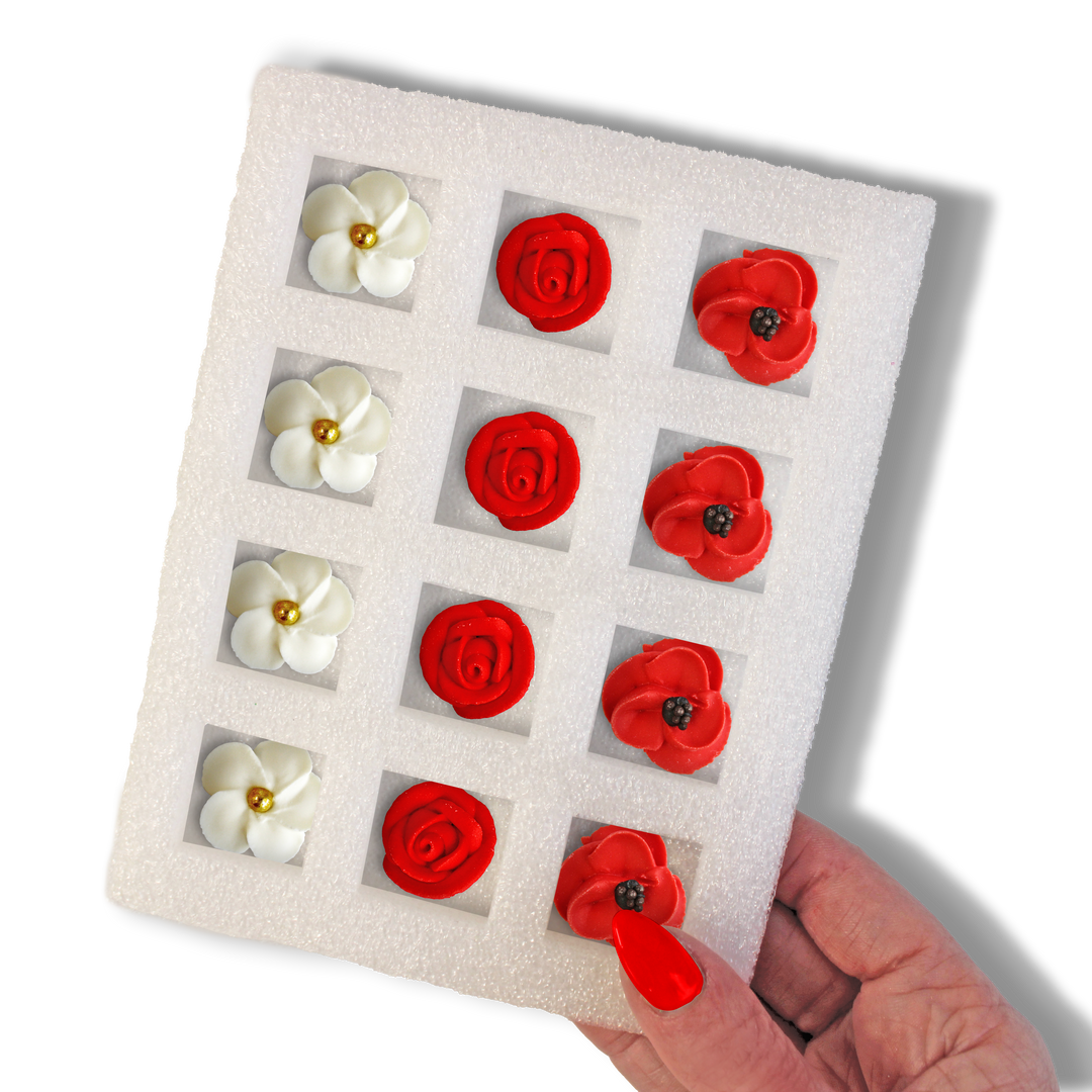 A set of 12 hand-piped Red Flower Bouquet Royal Icing Decorations, featuring red poppies, red roses, and white and gold flowers, measuring 0.75" in size. Perfect for adding elegance and sophistication to your Mother's Day baked goods