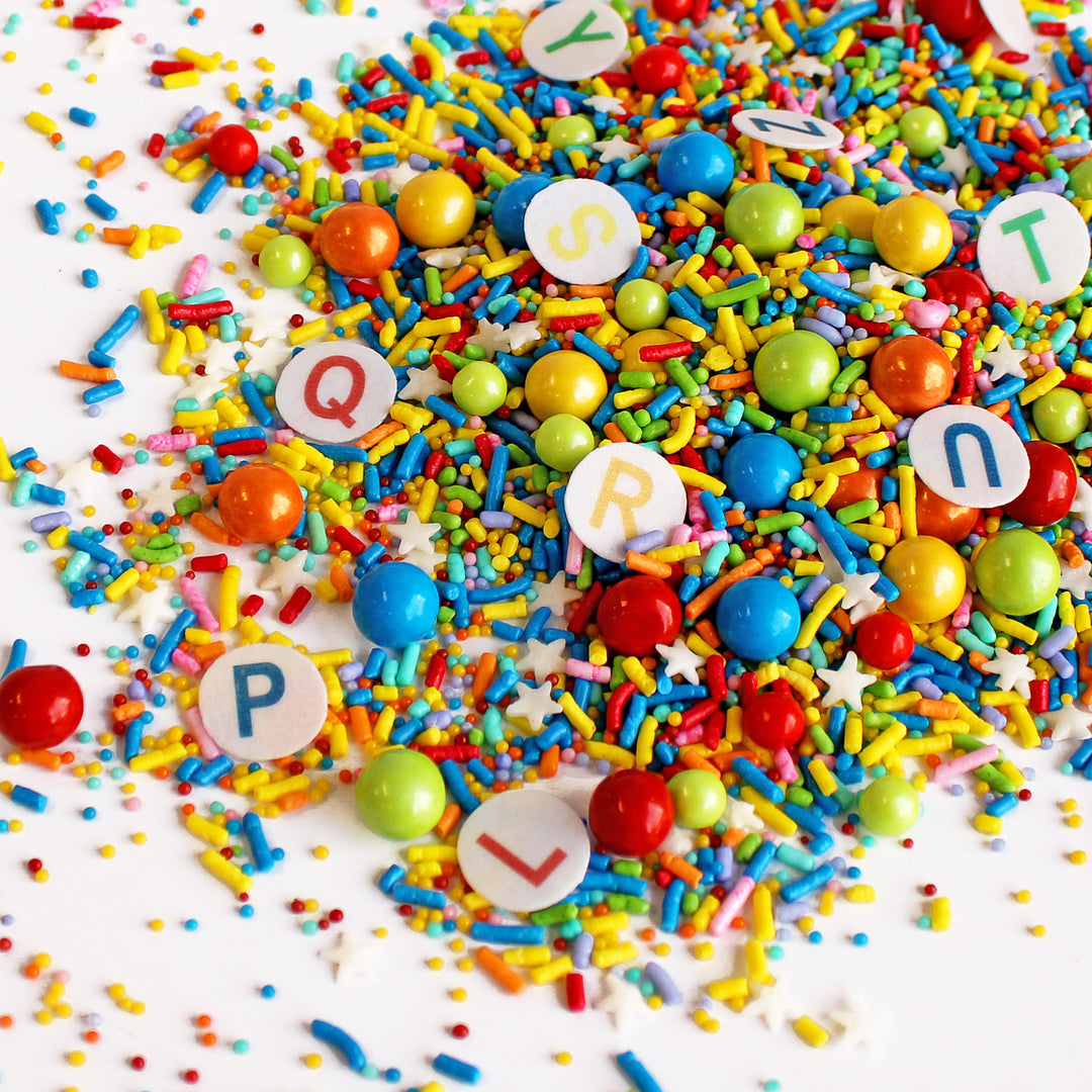 ittle Grads Sprinkle Mix - a colorful sprinkle mix with wafer paper alphabet confettis, perfect for graduation, pre-k, and kindergarten themes.