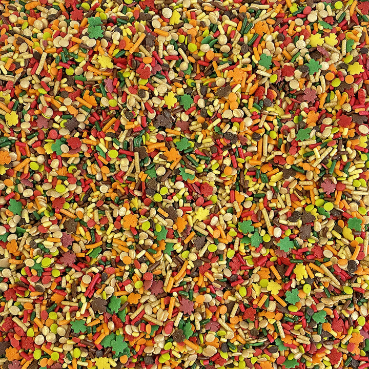 Close-up of "Talk Turkey To Me" Sprinkle Mix - a festive blend of red, orange, yellow, gold, dark green, and brown, perfect for autumn treats.