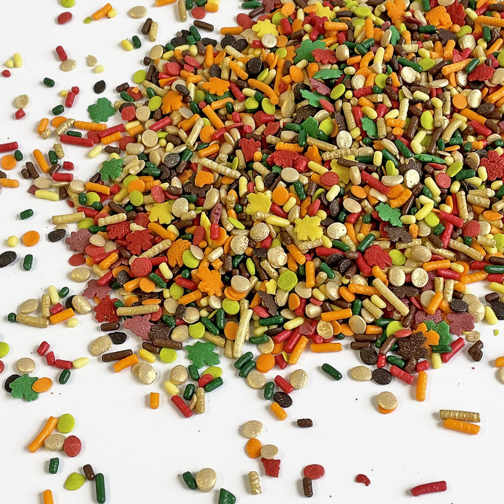 Close-up of "Talk Turkey To Me" Sprinkle Mix - a festive blend of red, orange, yellow, gold, dark green, and brown, perfect for autumn treats.